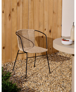 Eltiera stackable chair in synthetic rattan and black steel frame