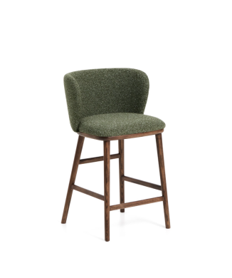 Ciselia stool in thick dark green chenille and solid ash wood legs with a walnut finish.